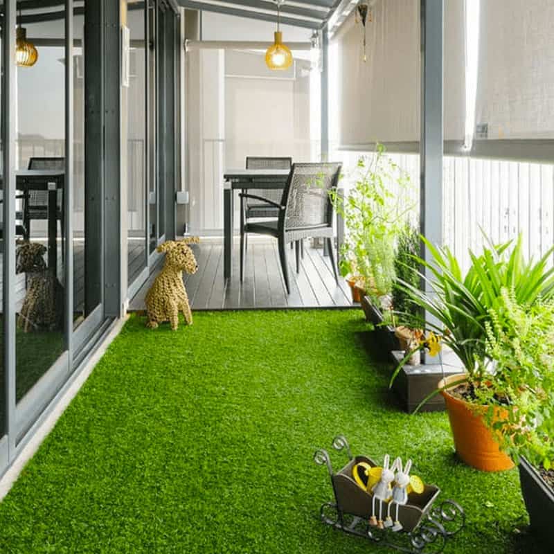 Small Balcony with a Charming Garden Using Artificial Grass