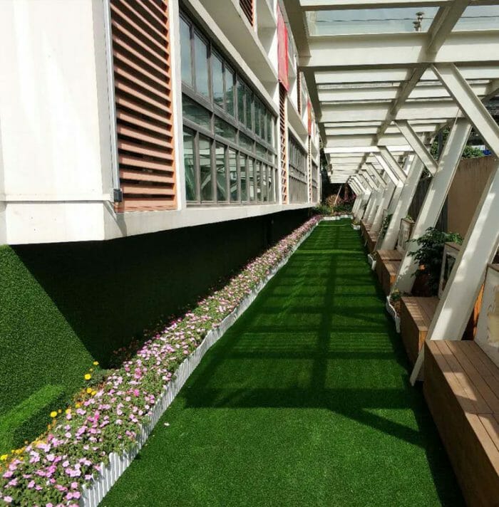 Artificial grass serves as a valuable tool in unifying architecture