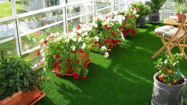 Balcony with Artificial Grass and Potted Plants