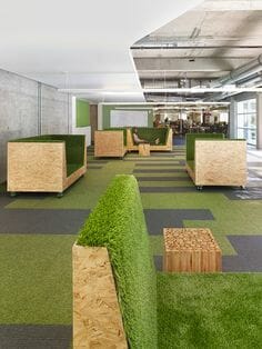 Creating a Cozy Indoor Oasis with Wooden Base and Long Artificial Grass Sofas