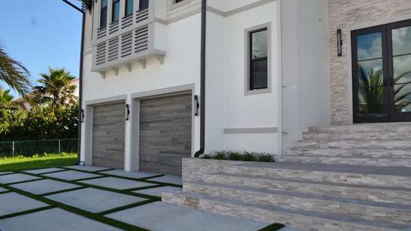 Enhancing Driveways with Artificial Grass Between Pavers