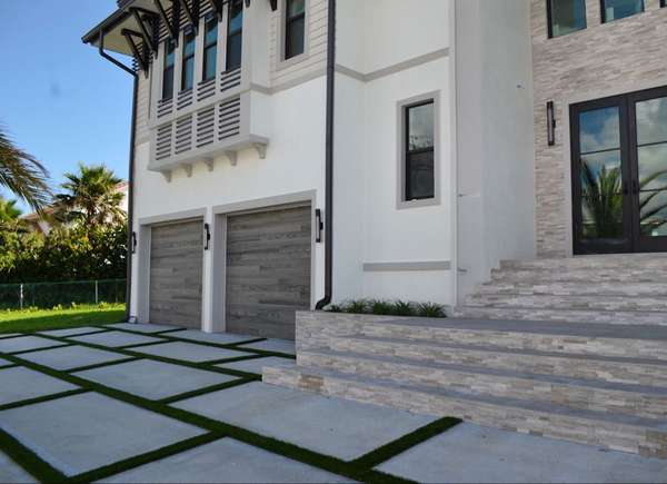Enhancing Driveways with Artificial Grass Between Pavers