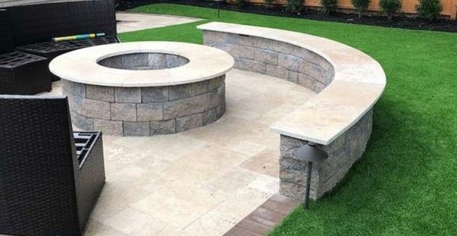 Integrating artificial turf into the landscaping around a patio and gas fire pit