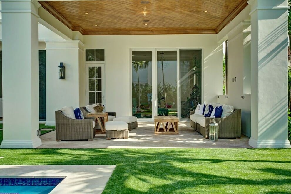 Surround the area outside your balcony with lush artificial grass