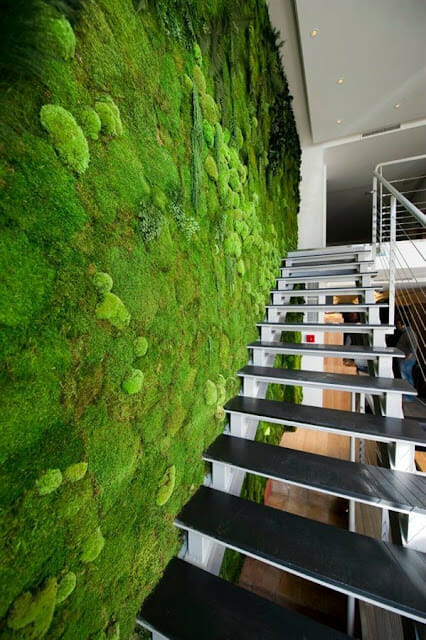 Incorporating an artificial grass backdrop into your staircase design