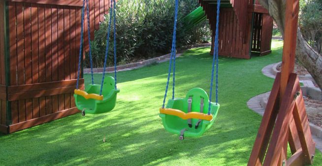 Swing-Installation-on-Artificial-Turf