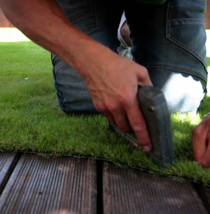 How to secure artificial grass to wood