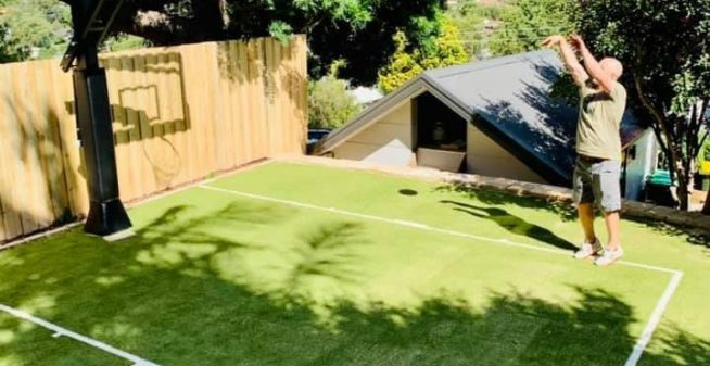 Outdoor backyard sports court design with artificial grass