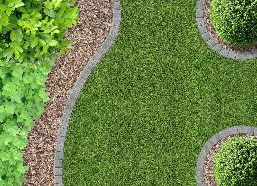 how to cut artificial grass around curves