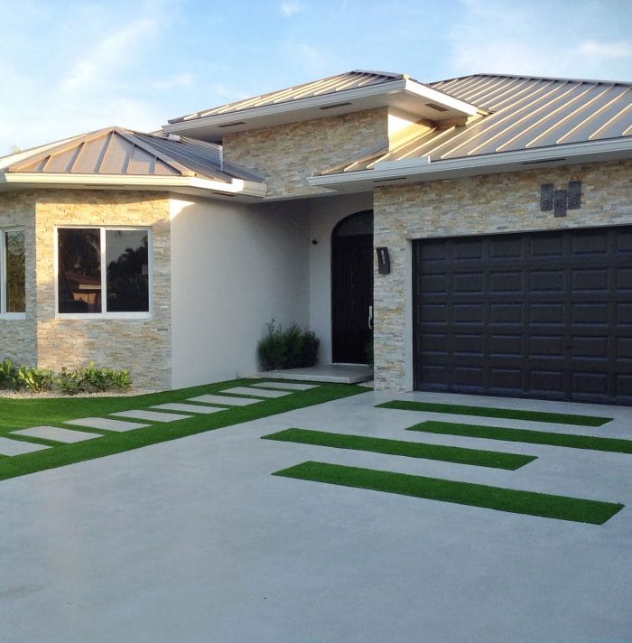 Concrete driveway with grass strips