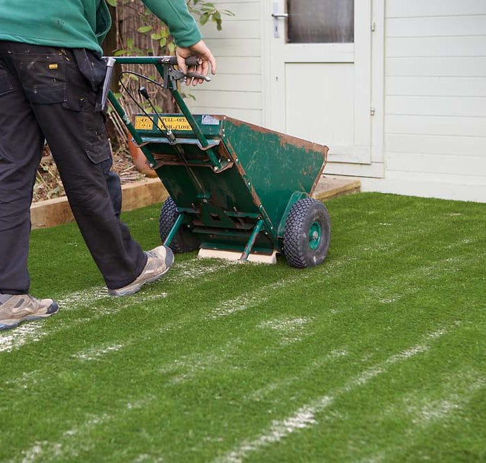 How to put sand on artificial grass