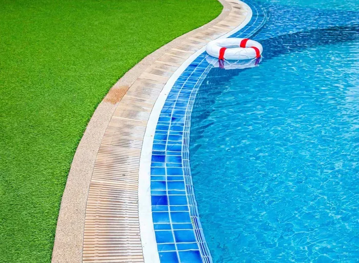 Artificial grass around a pool