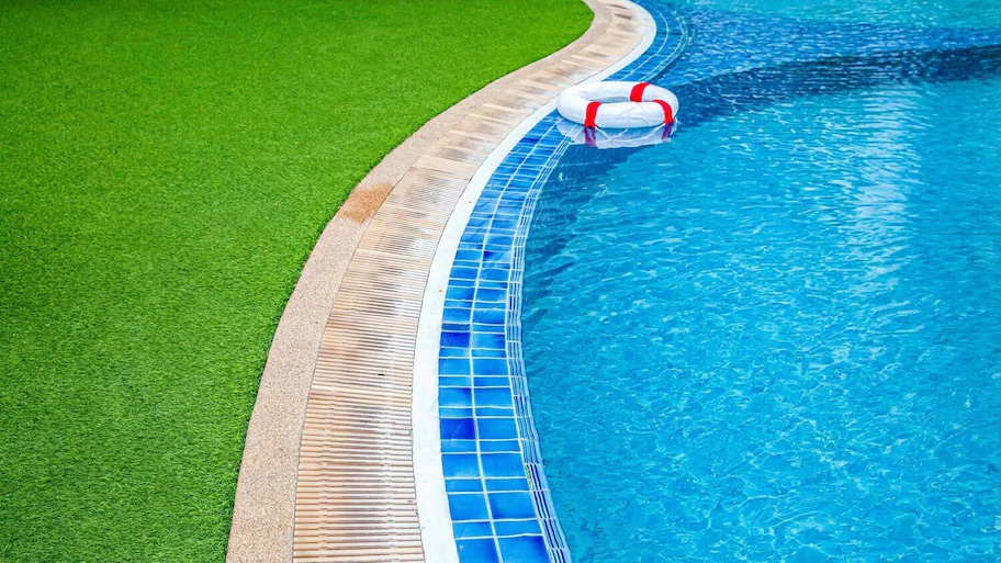 Artificial grass around a pool