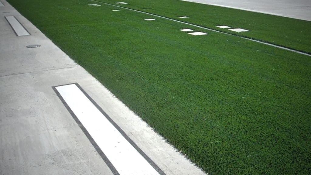 Artificial grass for airport runways and taxiways