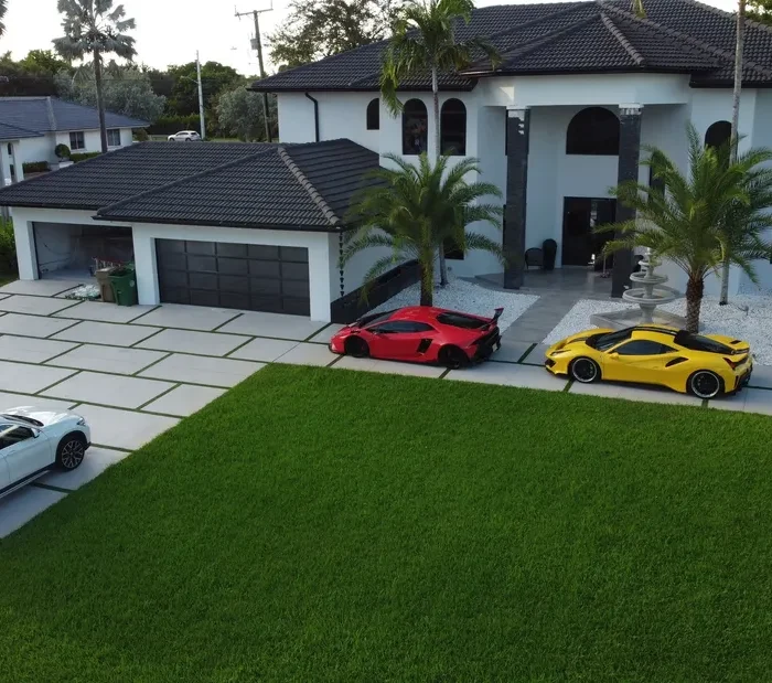 modern concrete and grass driveway